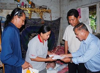 Sattahip officials donated cash, food and diapers for 16-month-old Nathakorn Sae-Chua.